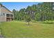 Spacious backyard with a tree adding a touch of nature to the outdoor living space at 208 Cottonwood Cir, Peachtree City, GA 30269