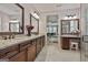 Spa bathroom offering granite countertops, a double vanity and a separate toilet room at 208 Cottonwood Cir, Peachtree City, GA 30269