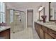 Elegant bathroom featuring a glass-enclosed shower, granite countertops, and modern fixtures at 208 Cottonwood Cir, Peachtree City, GA 30269