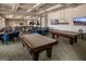 Well-lit billiards room features multiple tables and ample space for recreation and socializing at 208 Cottonwood Cir, Peachtree City, GA 30269