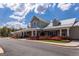 Charming community clubhouse featuring covered front porch and colorful landscaping around the building at 208 Cottonwood Cir, Peachtree City, GA 30269