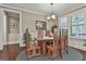 Traditional dining room features a wood table, chairs, and natural light from the window at 208 Cottonwood Cir, Peachtree City, GA 30269