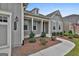 Attractive front entrance showcasing a well-kept yard, manicured bushes, and inviting walkway at 208 Cottonwood Cir, Peachtree City, GA 30269