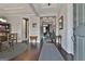 Elegant foyer featuring hardwood floors, decorative rugs, and a view into other rooms at 208 Cottonwood Cir, Peachtree City, GA 30269