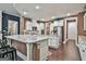Bright kitchen with a large island, white cabinetry, granite countertops and stainless appliances at 208 Cottonwood Cir, Peachtree City, GA 30269