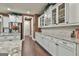 The long countertop features white cabinets, wine rack, and stainless steel refrigerator at 208 Cottonwood Cir, Peachtree City, GA 30269