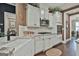 Bright kitchen featuring white cabinets, granite counters and stainless appliances at 208 Cottonwood Cir, Peachtree City, GA 30269
