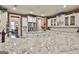 Spacious kitchen with granite countertops, white cabinets, stainless steel refrigerator, and open floor plan at 208 Cottonwood Cir, Peachtree City, GA 30269