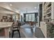 Open concept living room with dark wood flooring, round braided rug, fireplace, and view to dining room at 208 Cottonwood Cir, Peachtree City, GA 30269