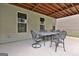 Covered patio area featuring an outdoor dining set, perfect for entertaining guests at 208 Cottonwood Cir, Peachtree City, GA 30269