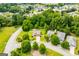 Aerial view of a home surrounded by lush trees in a Gathering-friendly neighborhood at 101 Deer Park Dr, Carrollton, GA 30116