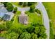 Aerial view of landscaped yard, cul-de-sac street, fenced-in backyard and mature trees at 101 Deer Park Dr, Carrollton, GA 30116