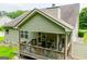 Spacious back deck perfect for outdoor entertaining, connected to the home with green siding and backyard views at 101 Deer Park Dr, Carrollton, GA 30116
