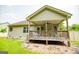 Inviting back porch with ceiling fan, ideal for outdoor seating and relaxation at 101 Deer Park Dr, Carrollton, GA 30116