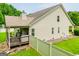 Spacious backyard with back deck and lush lawn enclosed by a white fence, perfect for outdoor activities at 101 Deer Park Dr, Carrollton, GA 30116
