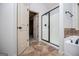 Well-lit bathroom features a shower with black trim, tile floor, and a cream colored tub and walls at 101 Deer Park Dr, Carrollton, GA 30116