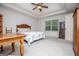 Spacious bedroom featuring a tray ceiling, window, and classic furnishings at 101 Deer Park Dr, Carrollton, GA 30116