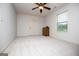 Bright bedroom features neutral walls, carpet, ceiling fan, and window at 101 Deer Park Dr, Carrollton, GA 30116