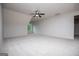 Bright bonus room with light walls and carpeting, a ceiling fan, and a single window at 101 Deer Park Dr, Carrollton, GA 30116