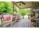 Inviting outdoor deck furnished with comfortable wicker seating and lush greenery, perfect for relaxation at 101 Deer Park Dr, Carrollton, GA 30116