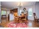 View of the kitchen and dining room featuring wooden table, chairs, and hardwood floors at 101 Deer Park Dr, Carrollton, GA 30116