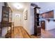 Welcoming entryway with hardwood floors, a view of the kitchen, and antique furniture at 101 Deer Park Dr, Carrollton, GA 30116