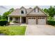 Charming home featuring a stone and vinyl exterior, two-car garage, and covered front porch at 101 Deer Park Dr, Carrollton, GA 30116
