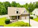 Charming two-story home with a welcoming front porch, a two-car garage, and a well-manicured lawn at 101 Deer Park Dr, Carrollton, GA 30116