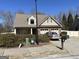 Street view of an attractive two-story home with a two-car garage and landscaped front yard at 101 Deer Park Dr, Carrollton, GA 30116