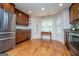 Eat-in kitchen featuring stainless steel appliances, and hardwood floors at 101 Deer Park Dr, Carrollton, GA 30116