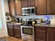 Kitchen with stainless steel range, microwave, and custom cabinetry with granite countertops, great layout at 101 Deer Park Dr, Carrollton, GA 30116