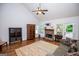 Bright living room with vaulted ceilings, stone fireplace, and hardwood floors at 101 Deer Park Dr, Carrollton, GA 30116