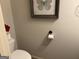 Small powder room featuring a toilet, a roll of toilet paper, and decor at 101 Deer Park Dr, Carrollton, GA 30116