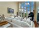 Cozy living room with a bay window and natural light at 675 Falls Lake Dr, Alpharetta, GA 30022