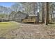 A large backyard with a deck, sliding doors, and a lush lawn, perfect for outdoor gatherings at 1967 Levgard Ln, Riverdale, GA 30296