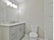 Bathroom featuring modern vanity with marble countertop and gold hardware at 1967 Levgard Ln, Riverdale, GA 30296
