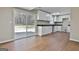 Bright kitchen with white cabinets, dark countertops, stainless steel appliances, and sliding glass doors at 1967 Levgard Ln, Riverdale, GA 30296