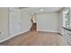 Open living area with wood floors and a staircase, perfect for entertaining at 1967 Levgard Ln, Riverdale, GA 30296