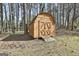 Backyard storage shed with double doors provides plenty of room for garden tools and equipment at 1967 Levgard Ln, Riverdale, GA 30296