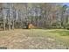 Wooden shed in the backyard, providing ample outdoor storage space for tools and equipment at 1967 Levgard Ln, Riverdale, GA 30296