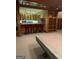 Built-in home bar featuring barstool seating and ample storage cabinets at 275 Old Mill Ct, Fayetteville, GA 30214