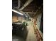 Basement garage with a John Deere utility vehicle and ladder at 275 Old Mill Ct, Fayetteville, GA 30214