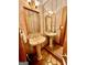 Charming powder room featuring a pedestal sink and decorative mirror at 275 Old Mill Ct, Fayetteville, GA 30214