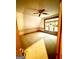 Cozy bedroom features natural light, ceiling fan and neutral carpeting at 275 Old Mill Ct, Fayetteville, GA 30214
