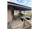 View of boat dock featuring a covered area with a boat, as well as beautiful waterfront scenery at 275 Old Mill Ct, Fayetteville, GA 30214