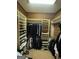 Custom closet with wood paneling, extensive shelving, and hanging storage for organization at 275 Old Mill Ct, Fayetteville, GA 30214