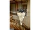 A grand foyer with staircase featuring a stunning chandelier hanging overhead at 275 Old Mill Ct, Fayetteville, GA 30214