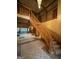 Grand foyer with a curved staircase and views into the living room at 275 Old Mill Ct, Fayetteville, GA 30214