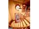 View of the grand foyer with an ornate chandelier, staircase, and stained-glass window at 275 Old Mill Ct, Fayetteville, GA 30214