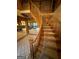 Foyer featuring a curved staircase leading to upper floors, with views into the kitchen and living area at 275 Old Mill Ct, Fayetteville, GA 30214